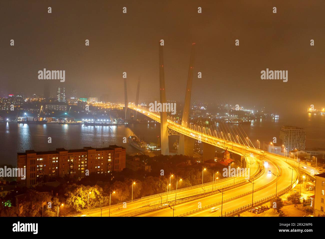 Built within the framework of Vladivostok's preparation to hosting the APEC Summit in autumn 2012, the bridge across the Zolotoy Rog Bay has already a Stock Photo