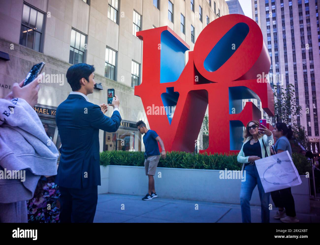 The public art sculpture 'Love' by Robert Indiana (1928-2018) is seen on display in Rockefeller Center in New York on Wednesday, September 20, 2023. The iconic 12 foot high sculpture at the entrance to the Channel Gardens as well as “ONE through ZERO (The Ten Numbers)” (1980-2001) and 193 flags with images from Indiana’s Peace Paintings will be on display until October 23, 2023.(© Richard B. Levine) Stock Photo