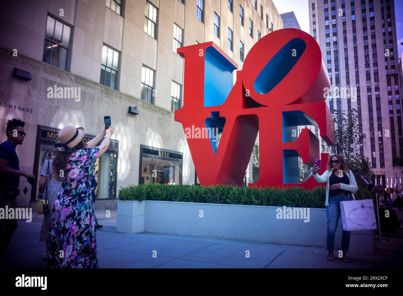 The public art sculpture 'Love' by Robert Indiana (1928-2018) is seen on display in Rockefeller Center in New York on Wednesday, September 20, 2023. The iconic 12 foot high sculpture at the entrance to the Channel Gardens as well as “ONE through ZERO (The Ten Numbers)” (1980-2001) and 193 flags with images from Indiana’s Peace Paintings will be on display until October 23, 2023.(© Richard B. Levine) Stock Photo