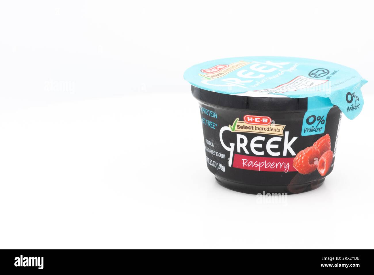 Cup of raspberry Greek yogurt. vitamins, minerals, and probiotics in