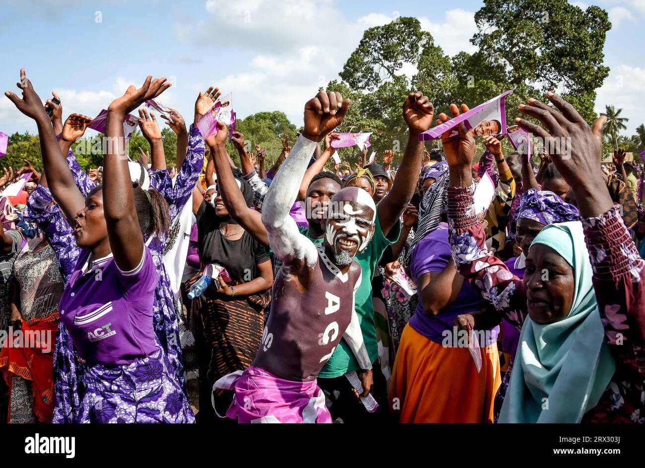 Supporters of Tanzania's opposition party, ACT Wazalendo sing and dance during the party's political rally in Tandahimba district, Mtwara region on Ma Stock Photo