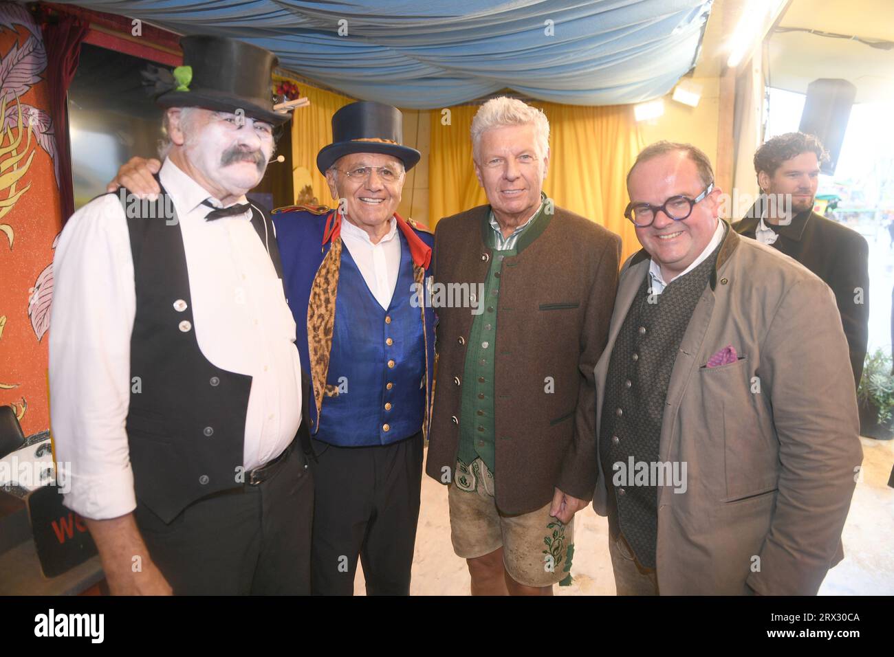 Munich, Germany. 22nd Sep, 2023. The executioner Ringo the Terrible (l-r), the 'Schichtl' Manfred Schauer, Munich's mayor Dieter Reiter and Clemens Baumgärtner, head of the Wiesn and speaker for labor and economy, stand on the stage of the 'Schichtl' on the Theresienwiese. The 188th Wiesn will take place this year from 16.09.- 03.10.2023. Credit: Felix Hörhager/dpa/Alamy Live News Stock Photo