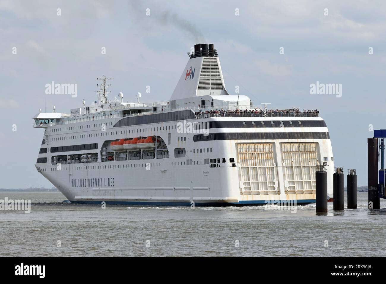 The car ferry Romantika leaves the port of Cuxhaven towards Norway on April 22, 2023. Stock Photo