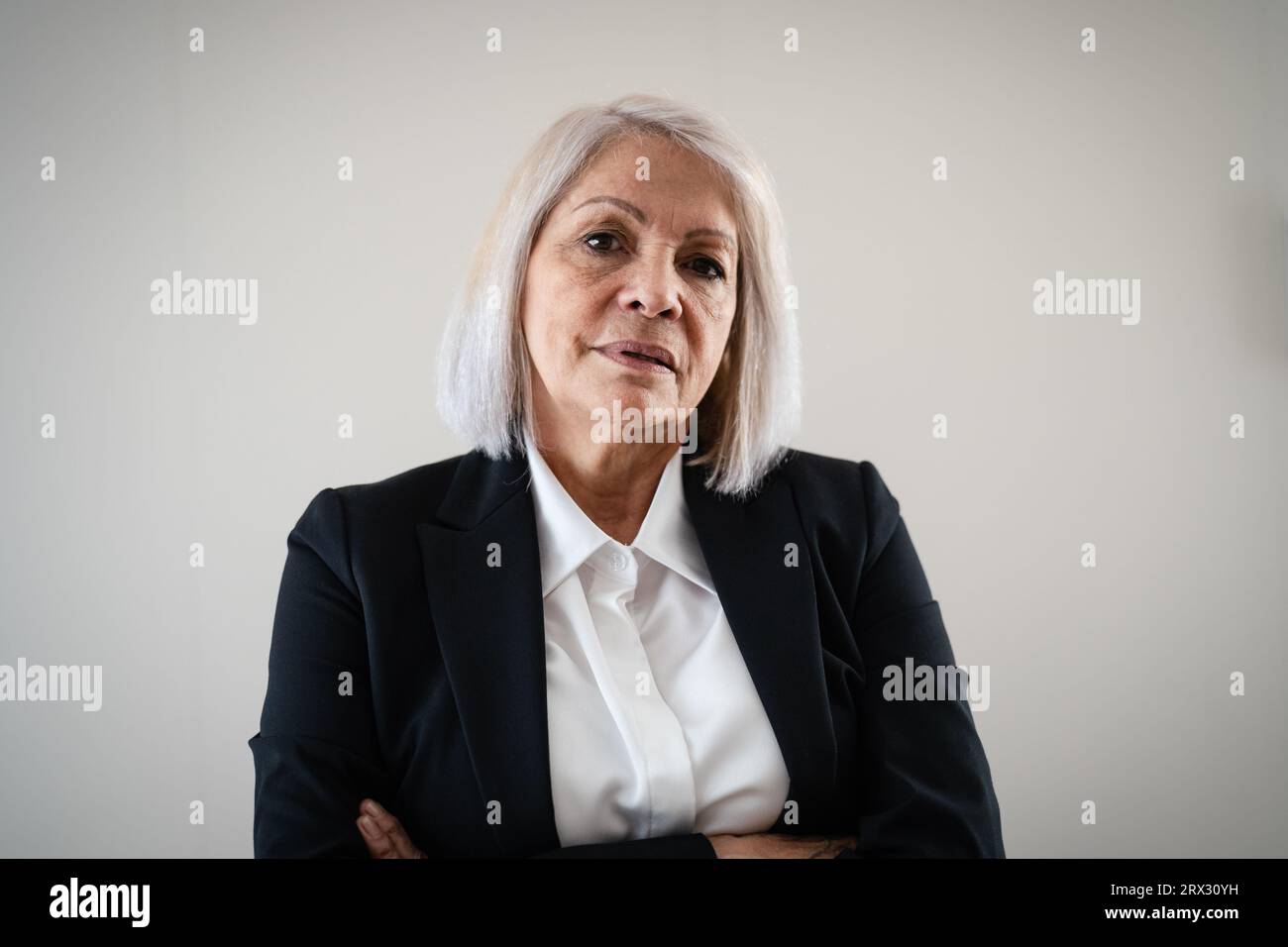 Senior business woman looking in camera Stock Photo