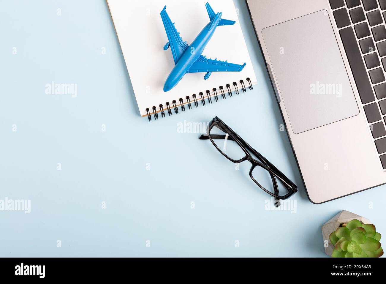 View home desk with airplane model and notebook . High quality photo Stock Photo