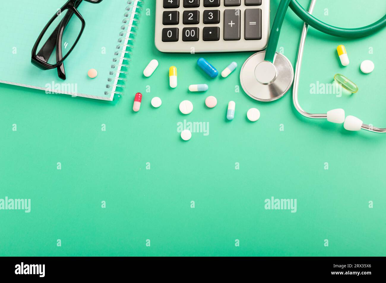 Medical concept with various medicines and calculator on blue background. High quality photo Stock Photo