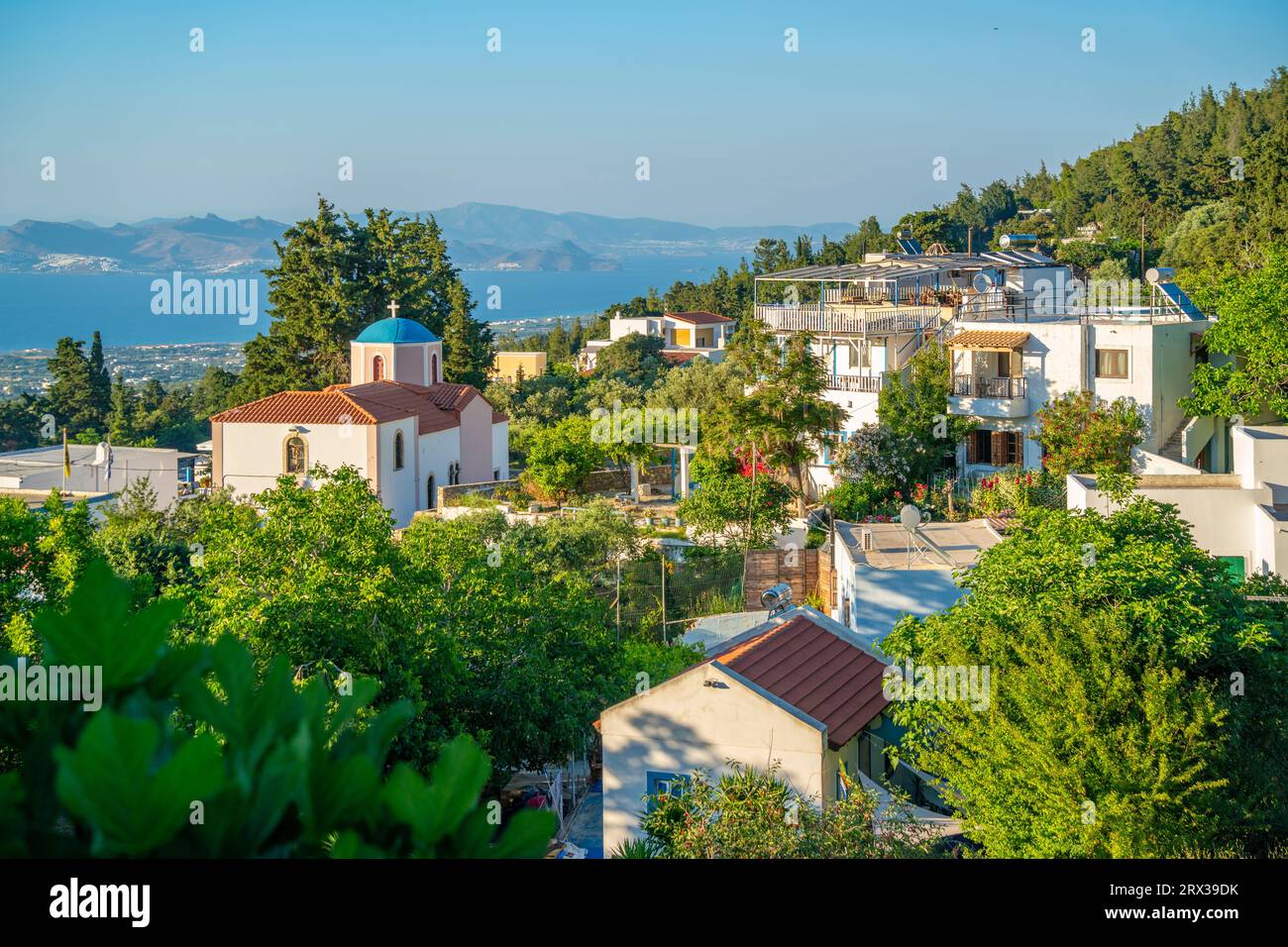 View of Greek Orthodox Church with sea in background, Zia Village, Kos Town, Kos, Dodecanese, Greek Islands, Greece, Europe Stock Photo