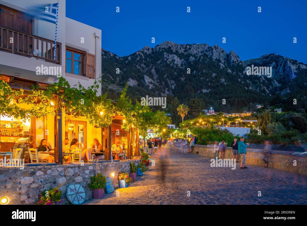 View of restaurant in Zia Sunset View at dusk, Zia Village, Kos Town, Kos, Dodecanese, Greek Islands, Greece, Europe Stock Photo