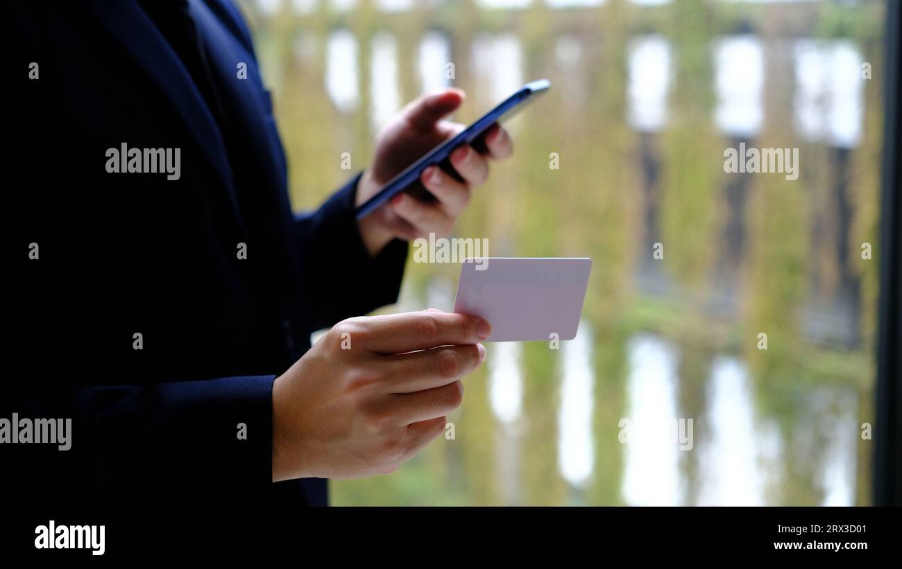 Man using smart phone and holding credit card with online shopping.Online payment concept. Stock Photo