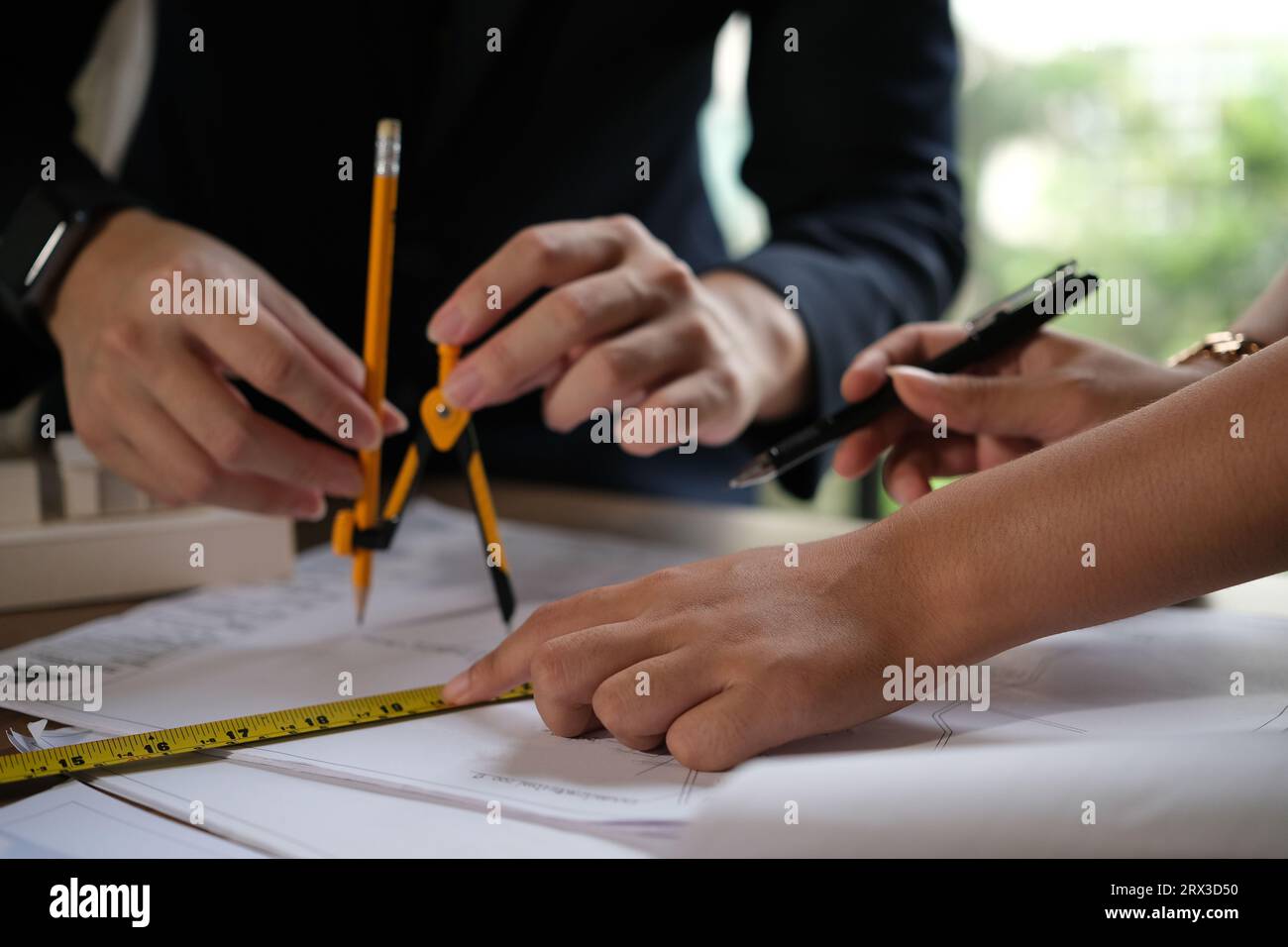 Architect doing consulting teamwork in the office. Stock Photo