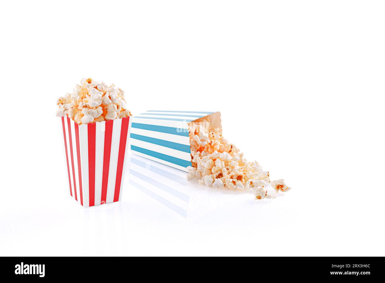 Glass with popcorn on a white background close-up Stock Photo