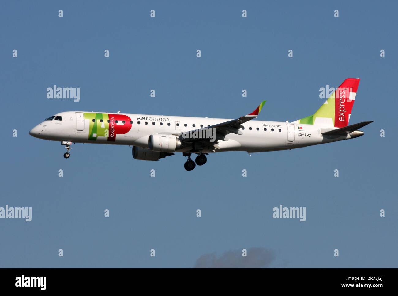 An Embraer 190 of TAP Express approaches London Gatwick Airport Stock