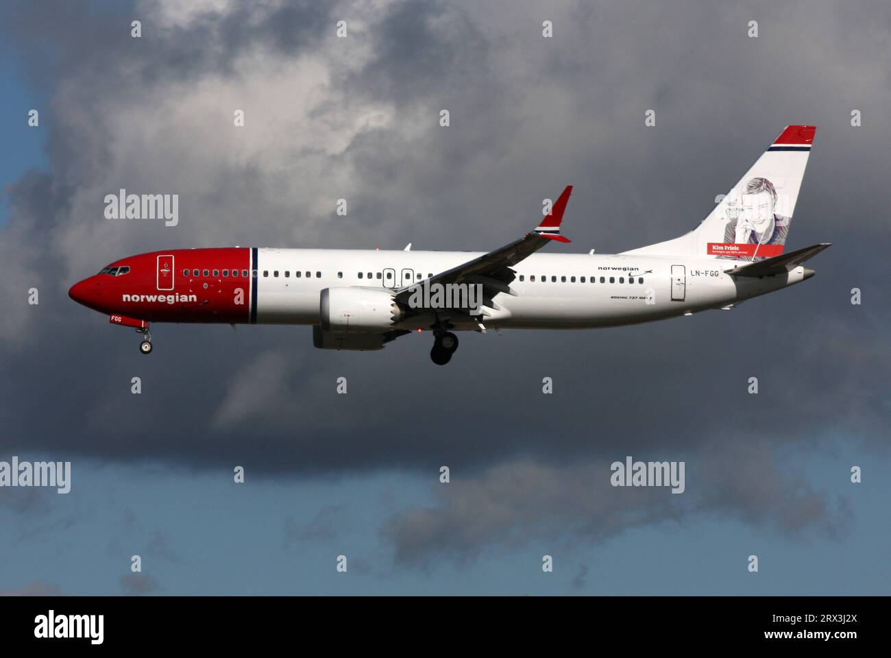 A Boeing 737 Max 8 of Norwegian with Kim Friele - Norwegian Gay Rights  Pioneer tail art approaches London Gatwick Airport Stock Photo - Alamy