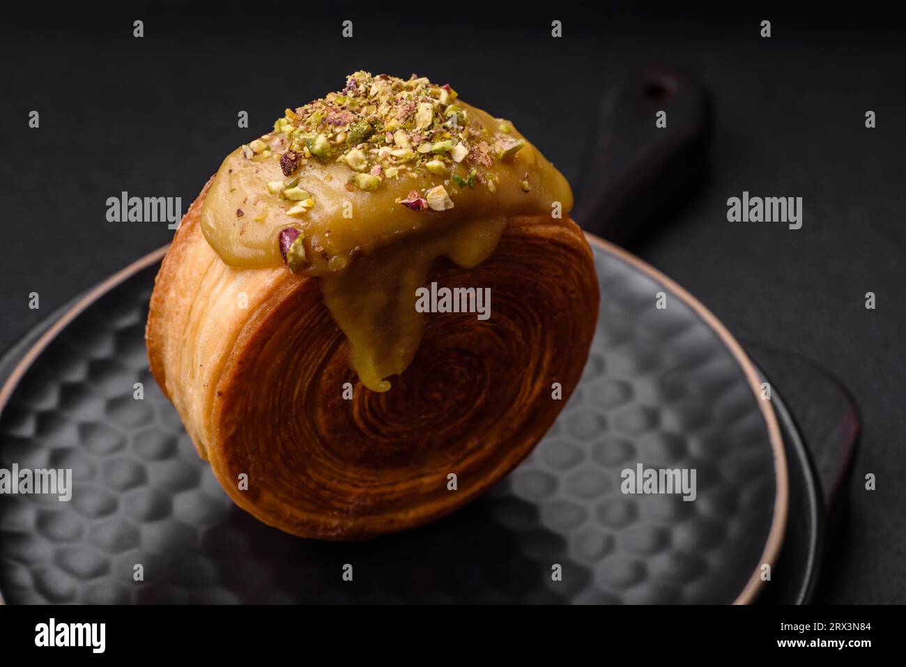 Round puff pastry croissant with raspberry filling or new york roll on ...