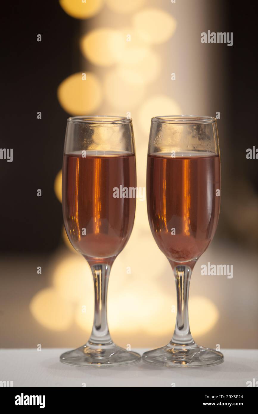 Two elegant glasses pink sparkling hi-res stock photography and images ...