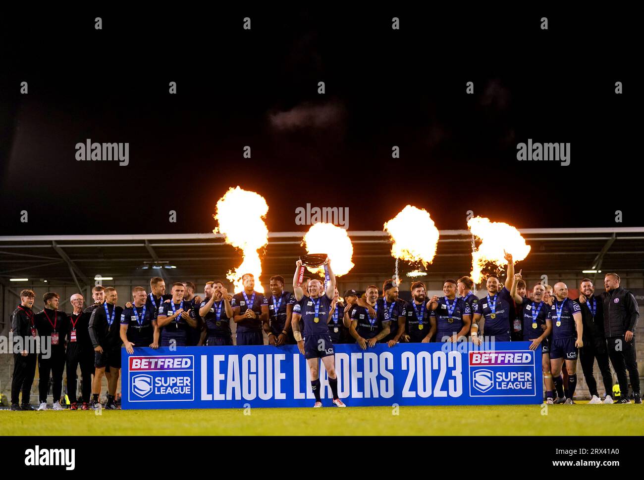Wigan Warriors players celebrate after winning the League Leaders' Shield following the Betfred Super League match at Leigh Sports Village. Picture date: Friday September 22, 2023. Stock Photo