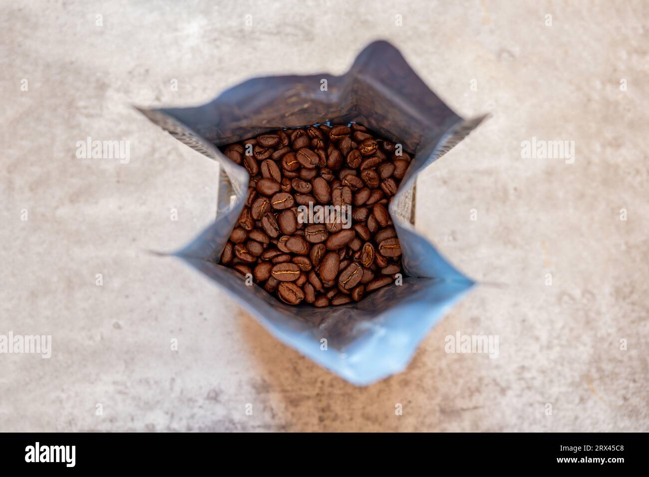 Coffee beans bag on grey background Stock Photo Alamy
