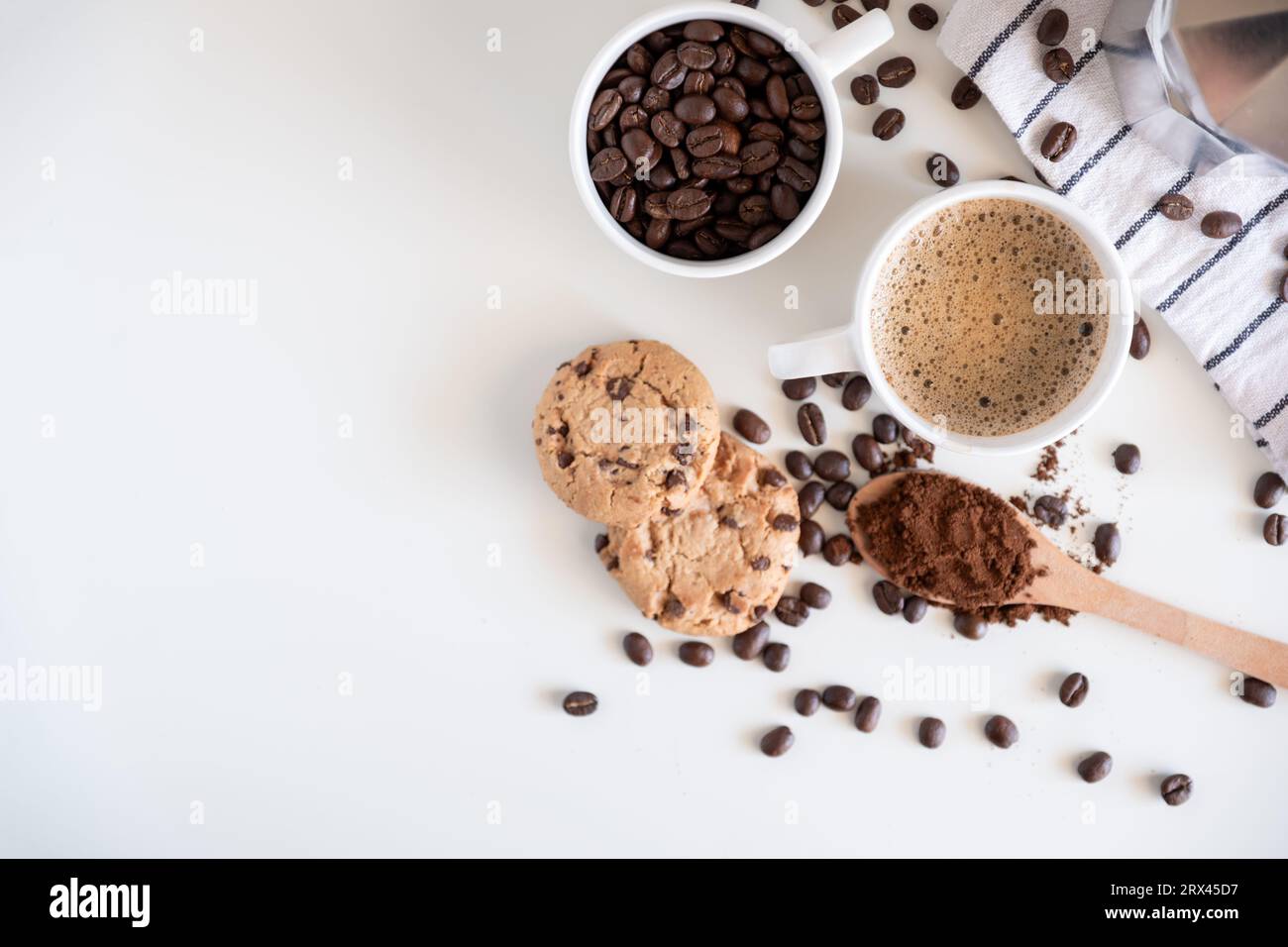 Coffee set of espresso boiler with grounded and beans of coffee on white background Stock Photo