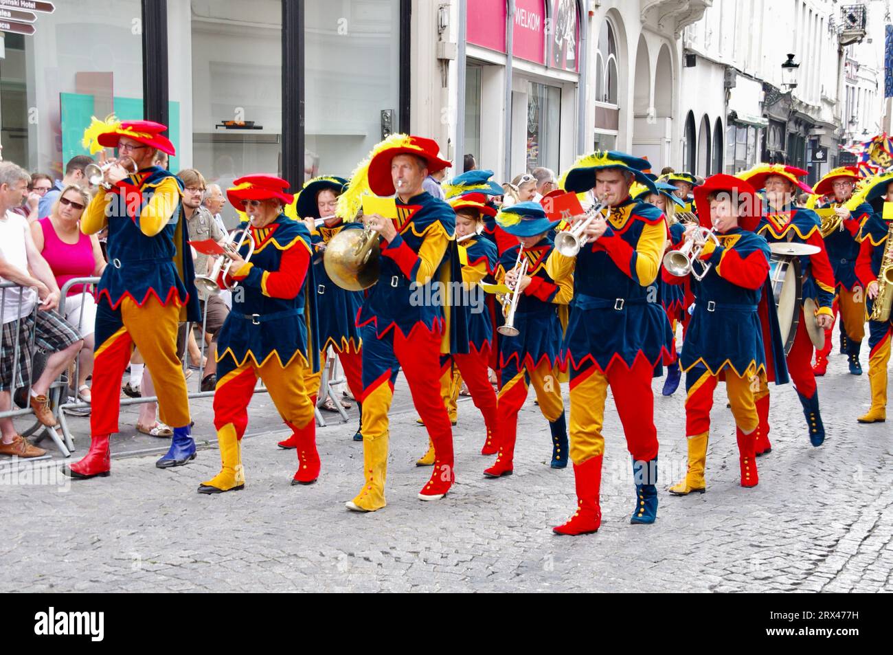 Marchers in colourful outfits in The 2012 Procession of the Golden Tree Pageant, held every 5 years since 1958. Bruges, Belgium. Stock Photo