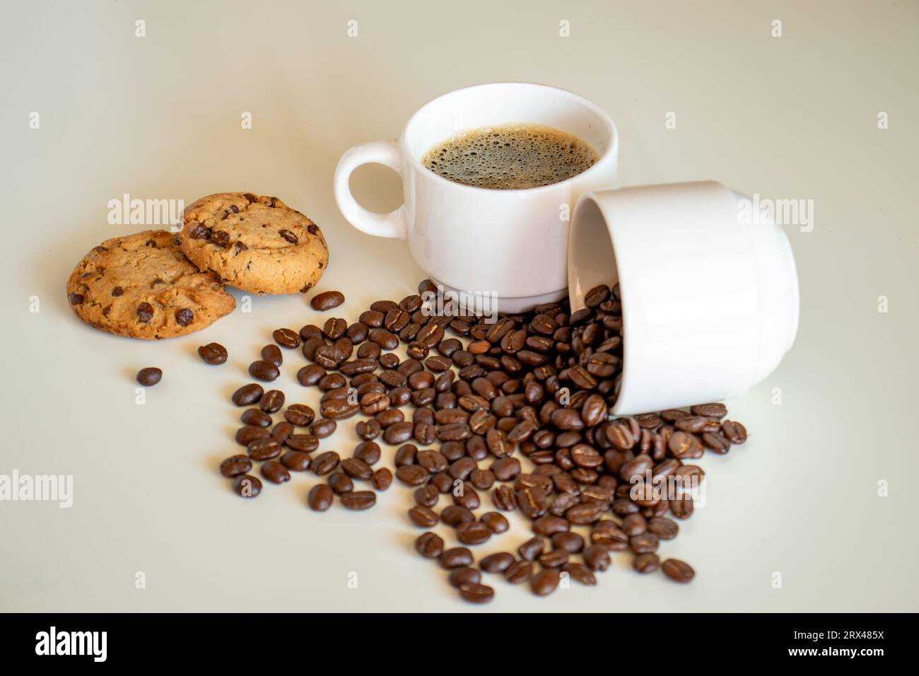 Cup of coffee and coffee drink with cookies on white background Stock Photo