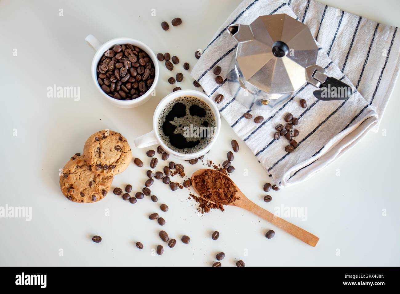 Coffee set of espresso boiler with grounded and beans of coffee on white background Stock Photo