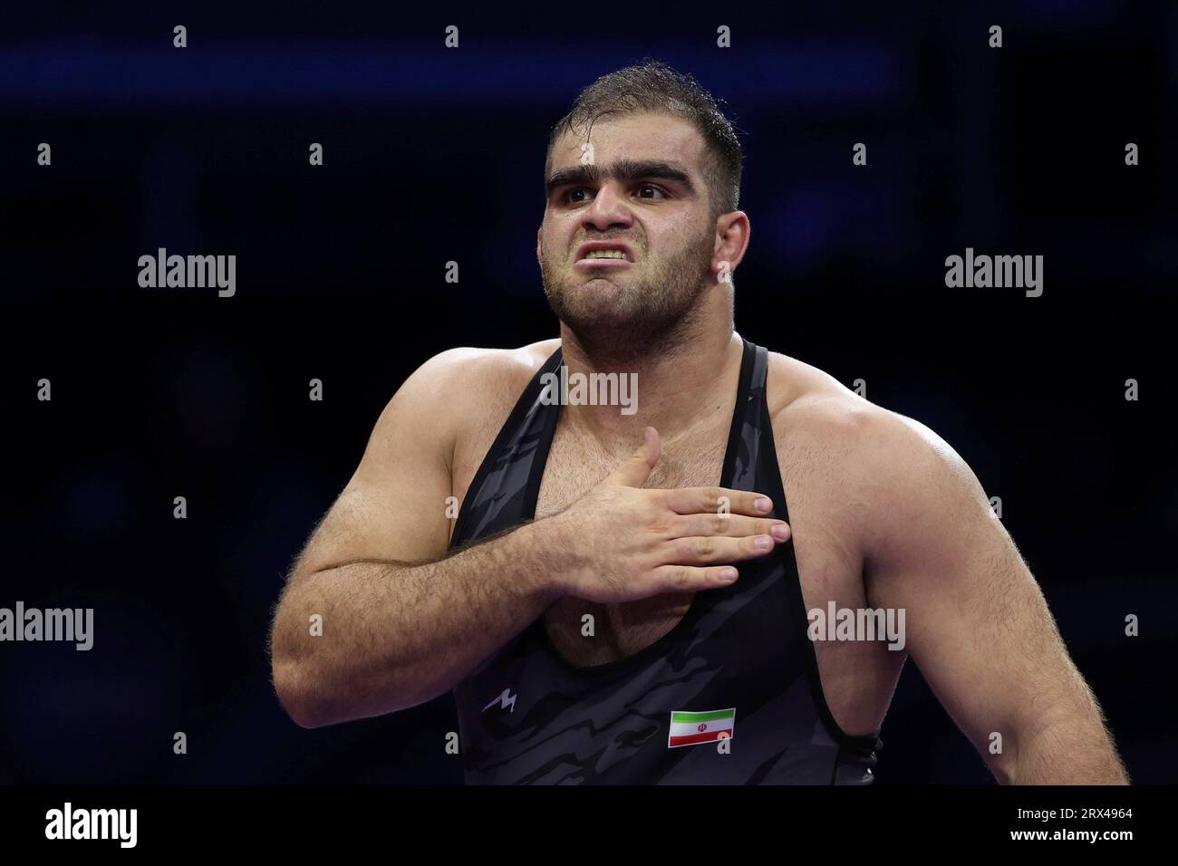 Amin MIRZAZADEH of Iran reacts after winning the Greco-Roman 130 