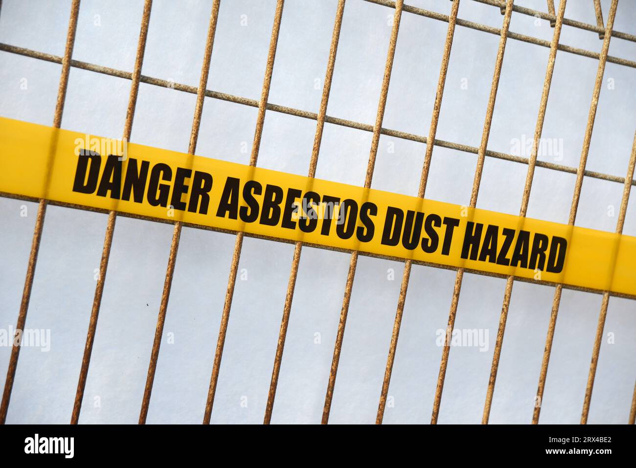 asbestos danger tape set up around a construction site Stock Photo Alamy
