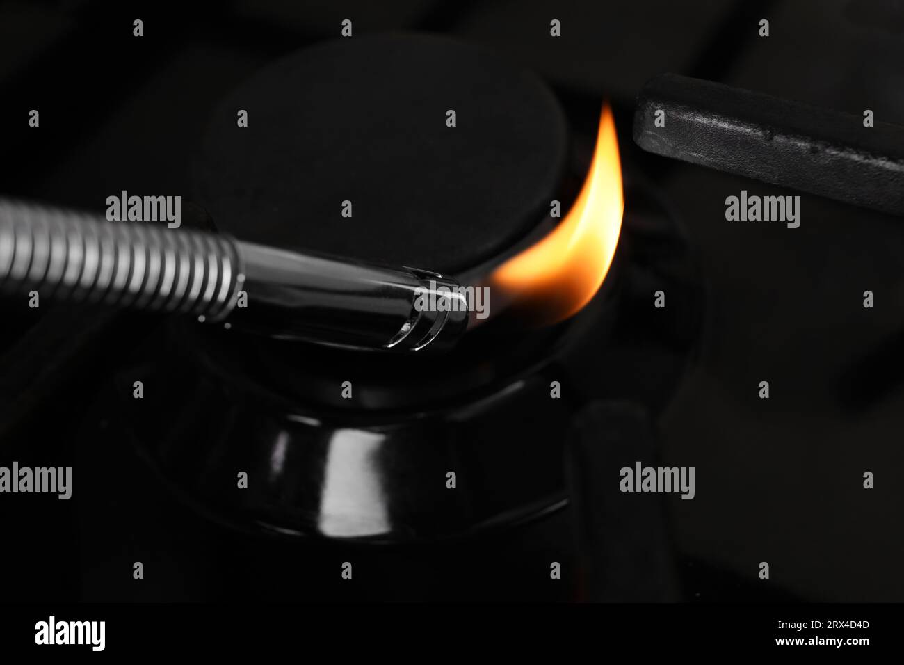 Lighting stove with gas lighter, closeup view Stock Photo Alamy