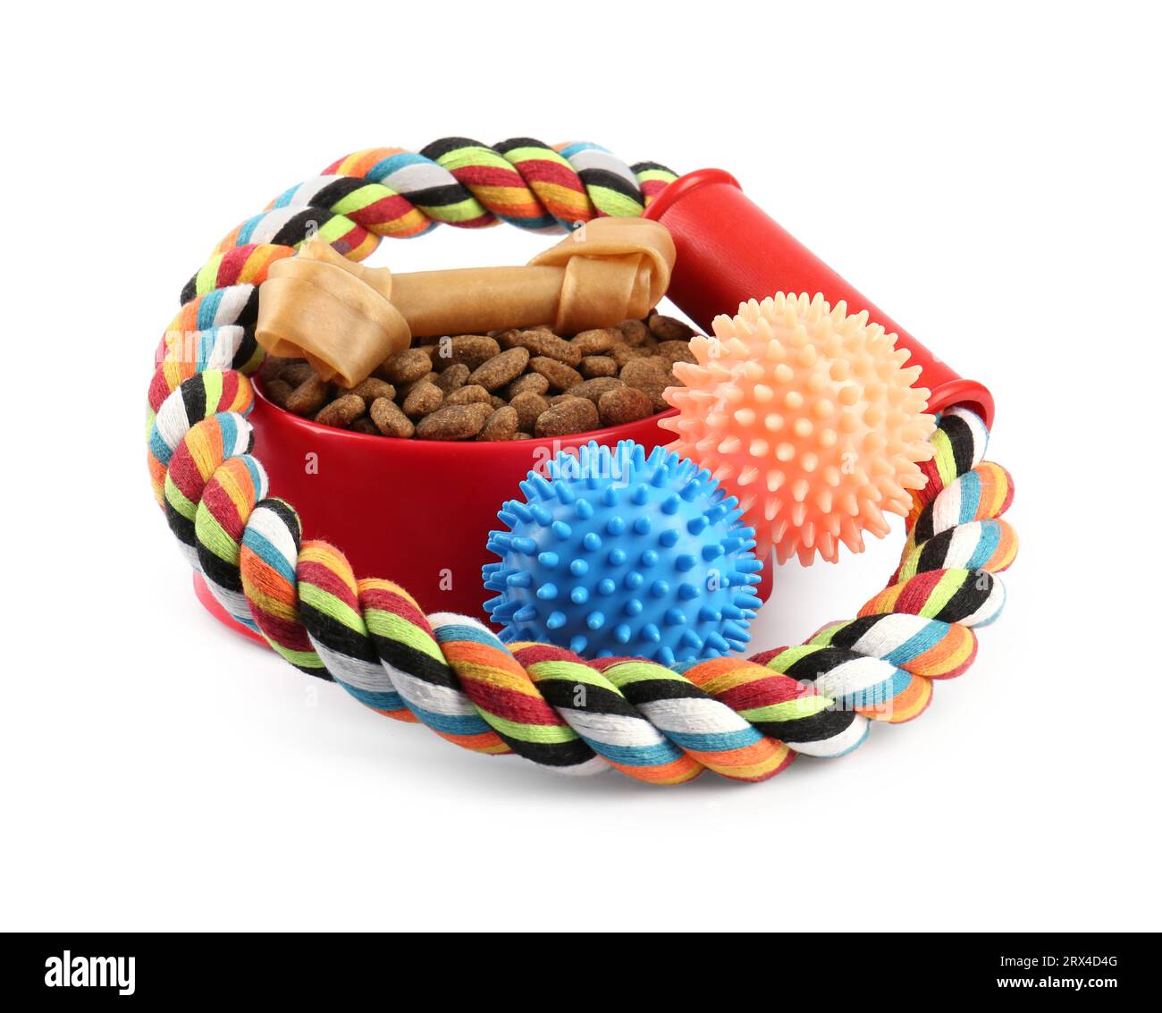 Pet dry food in bowl, treats and toys on white background. Shop