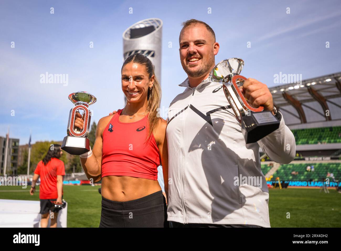 Valarie Allman (USA) and Matthew Denny (AUS) stand on the podium at the trophy ceremony at the Diamond League Championships at The Pre-Classic on Sund Stock Photo