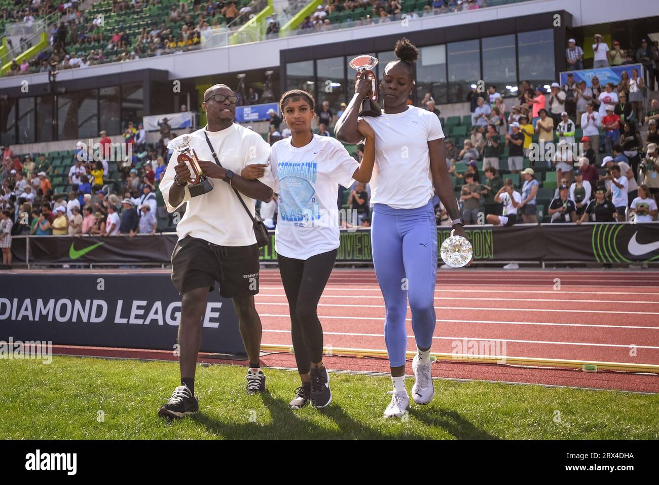 Christian Coleman (USA) and Shericka Jackson (JAM) walk out onto the field for the trophy ceremony at the Diamond League Championships at The Pre-Clas Stock Photo