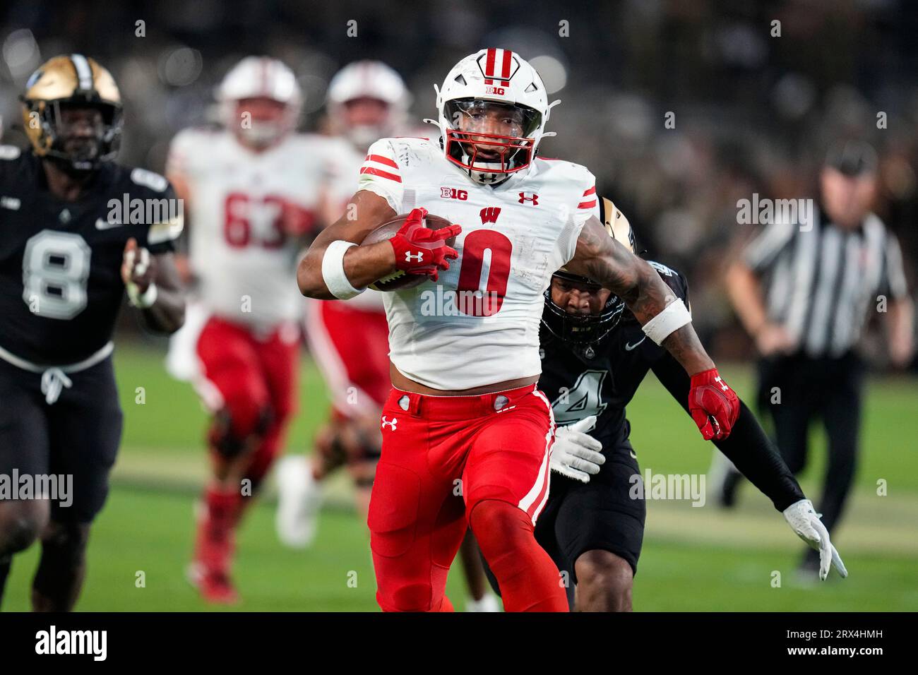 Wisconsin running back Braelon Allen (0) outruns Purdue linebacker