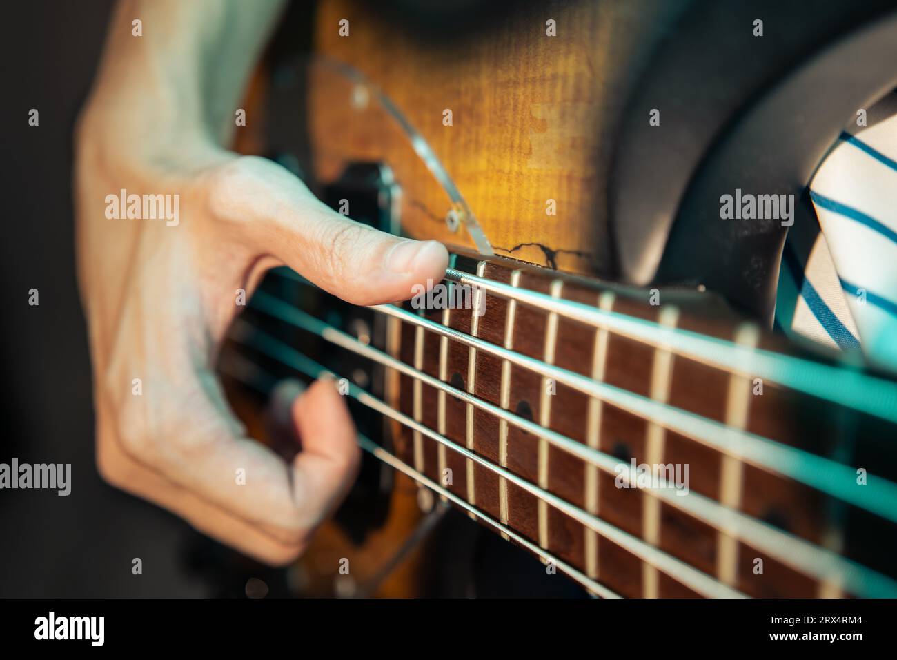 Bassist slapping electric bass guitar Stock Photo