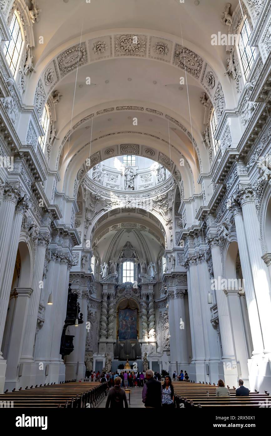 Munich, Germany - August 20, 2010: The main nave and altar of the Theatine Church of St. Cajetan and Adelaide (German: Theatinerkirche) Stock Photo