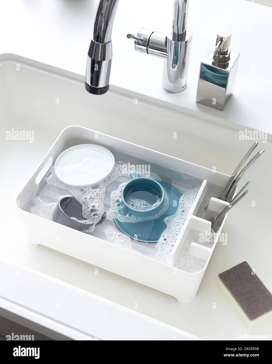 Dish washing, Dirty dishes soaking in kitchen sink Stock Photo Alamy