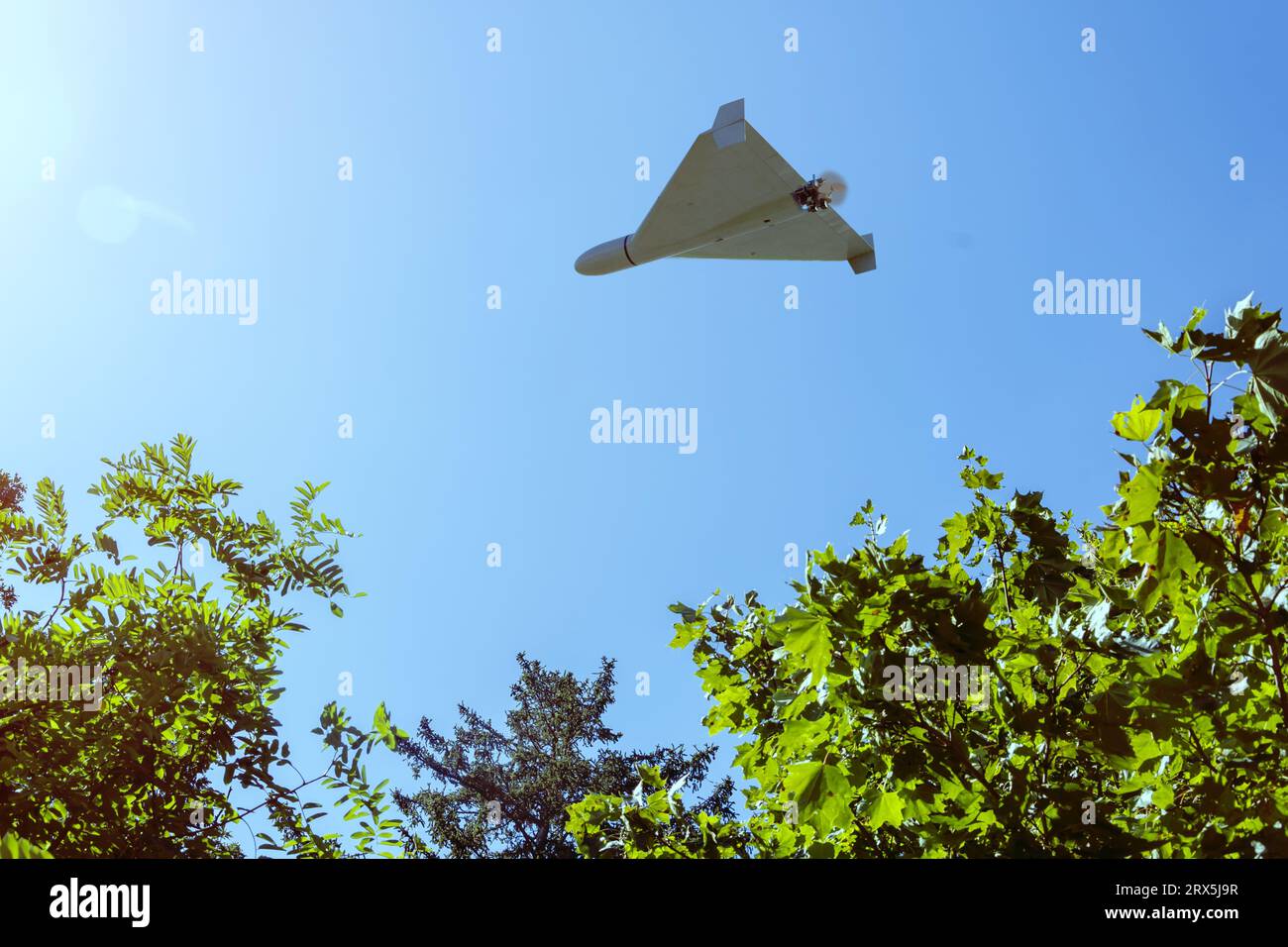 Shahed combat drone flying in the background of city fan and sky , view from below, drone attack, war in Ukraine, 3d render. Stock Photo