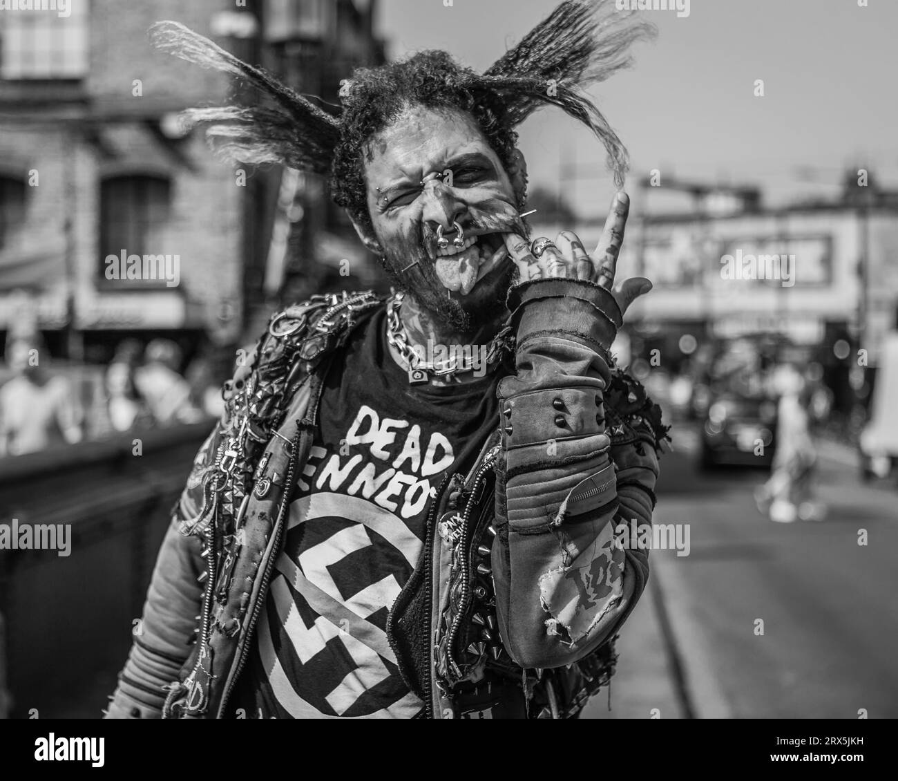 Black and white image of a punk on the bridge in Camden. Stock Photo