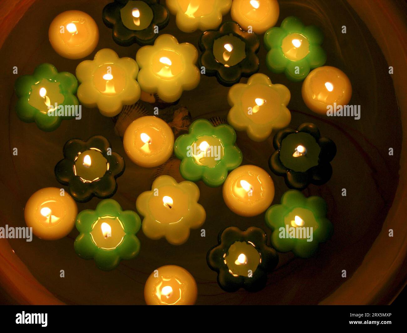 22 twenty-two burning floating candles in bowl, candlelight, candle atmosphere Stock Photo