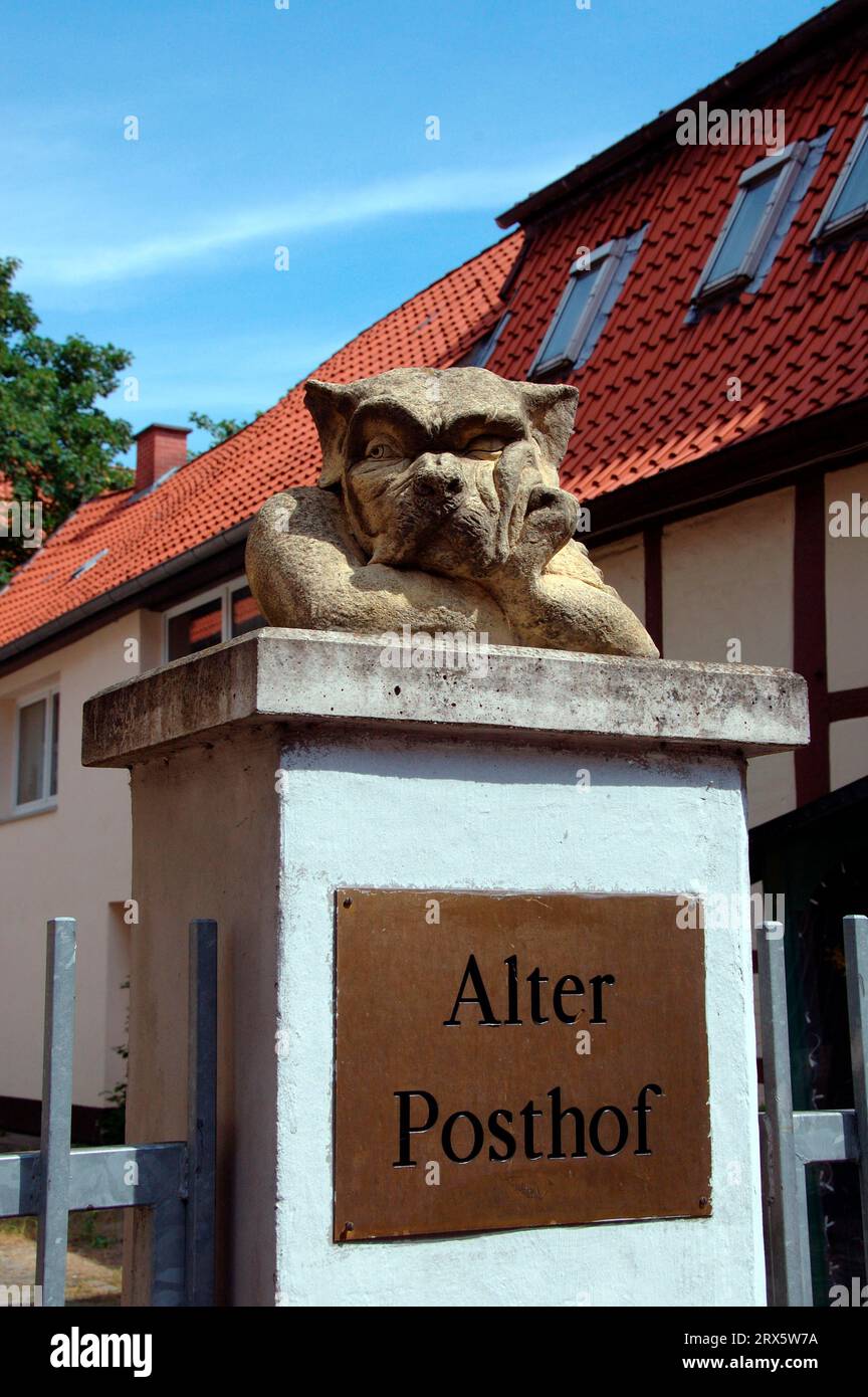 Dog statue and sign 'Alter Posthof', Celle, Lower Saxony, Germany Stock Photo