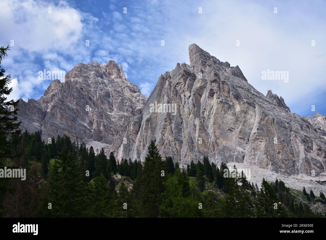 The pink colors of the Dolomite rocks stand out in the shapes of Mount Cristallo and Piz Popena Stock Photo