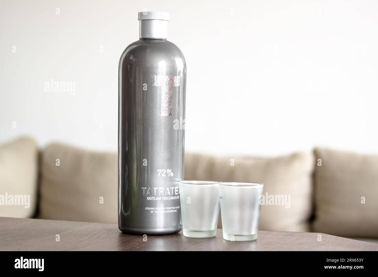 OSTRAVA, CZECH REPUBLIC - JUNE 21, 2023: TatraTea herbal spirit which is extremely strong with 72 percent of alcohol and two shots Stock Photo