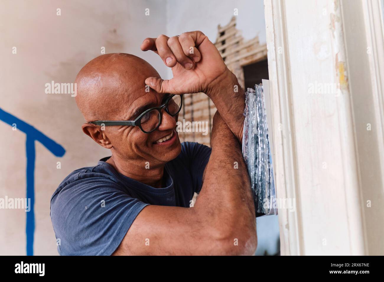 Happy construction worker with samples at site Stock Photo