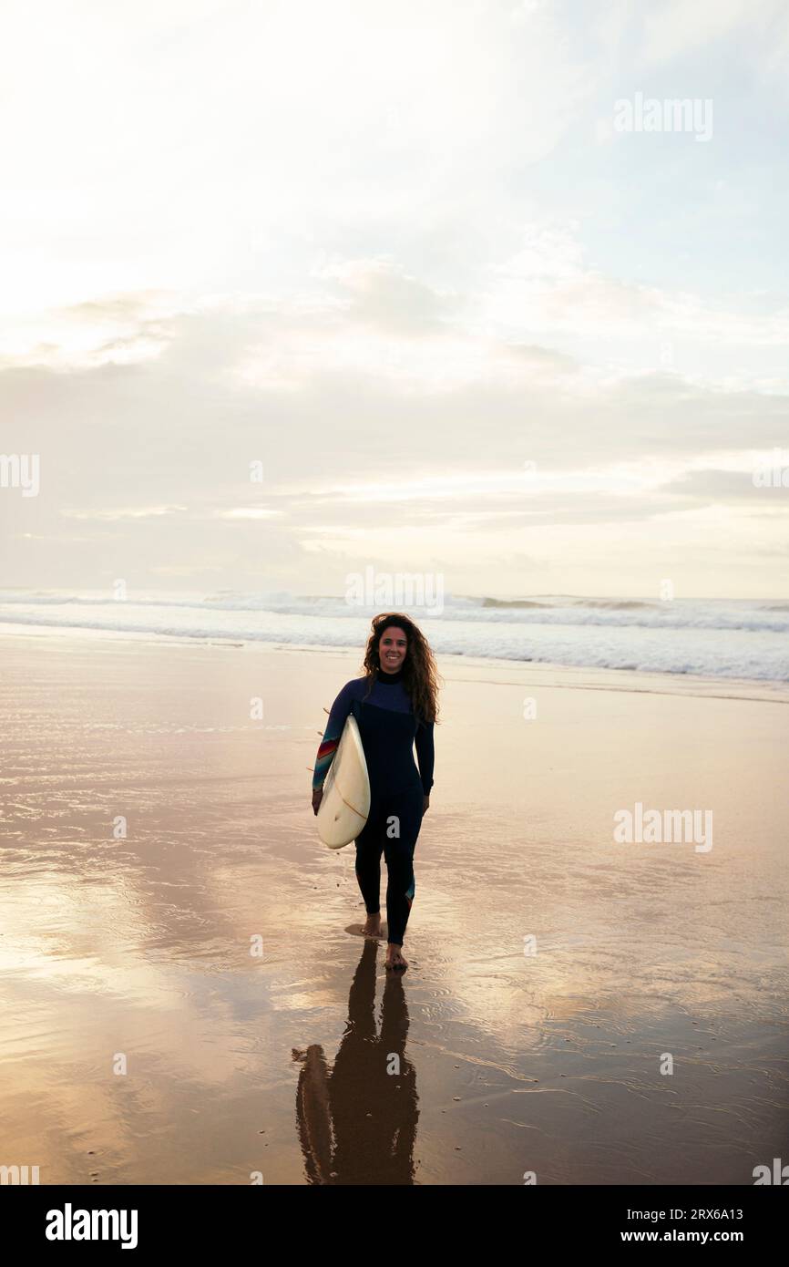 Female surfer beach sunset hi-res stock photography and images - Alamy