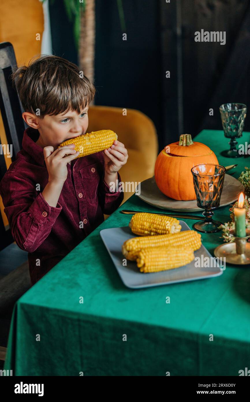 Boy eating dinner home hi-res stock photography and images - Alamy