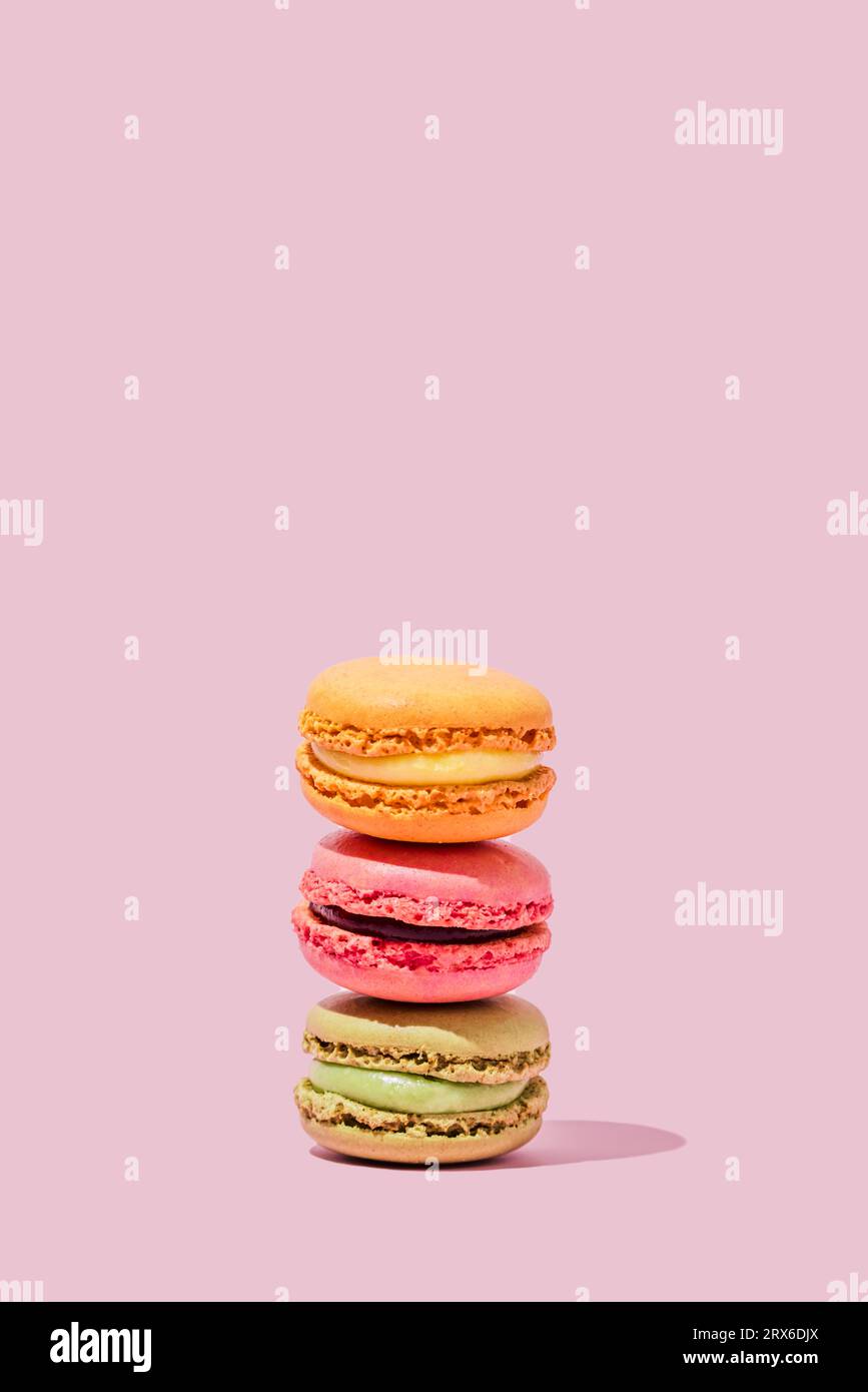 Multi colored macaroons stacked in studio Stock Photo
