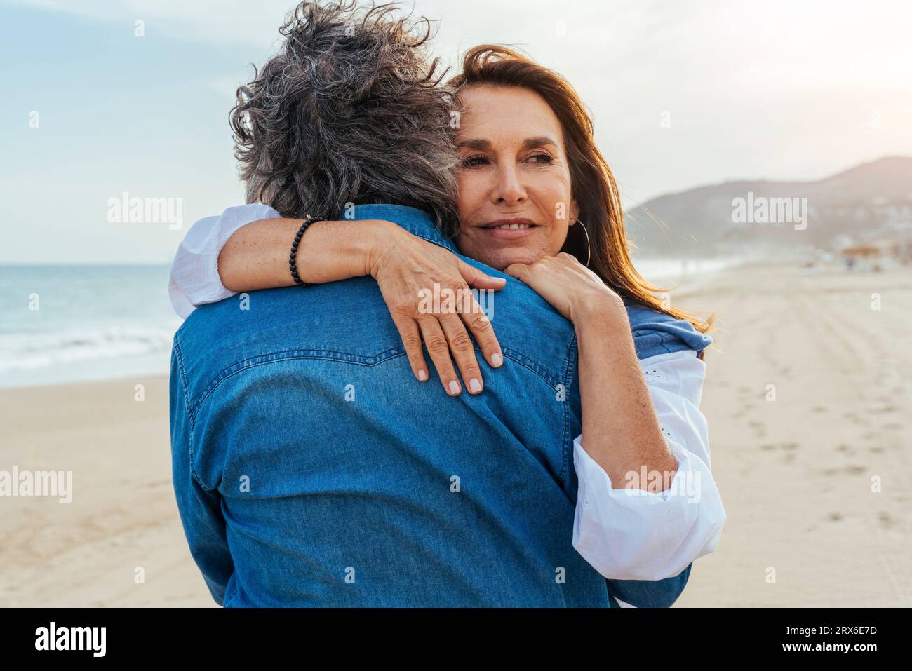 Woman sand falling on beach hi-res stock photography and images - Alamy
