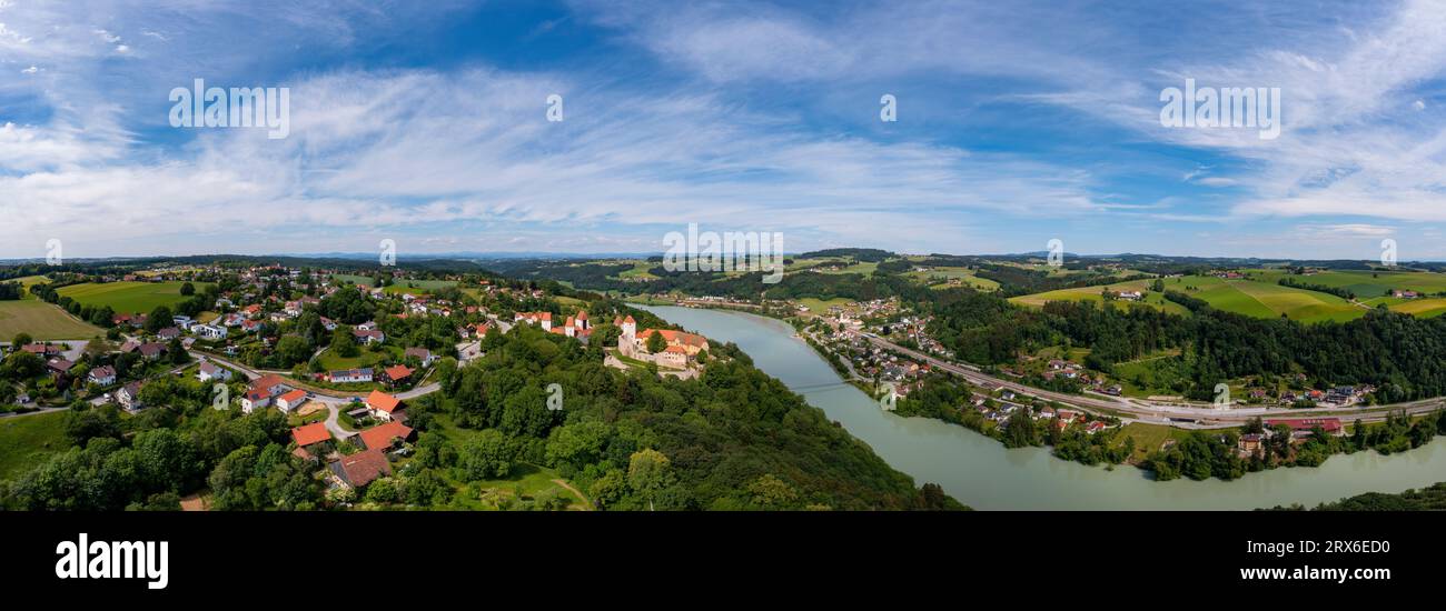 Germany, Bavaria, Drone view of Inn river separating Neuburg am Inn and Wernstein am Inn Stock Photo