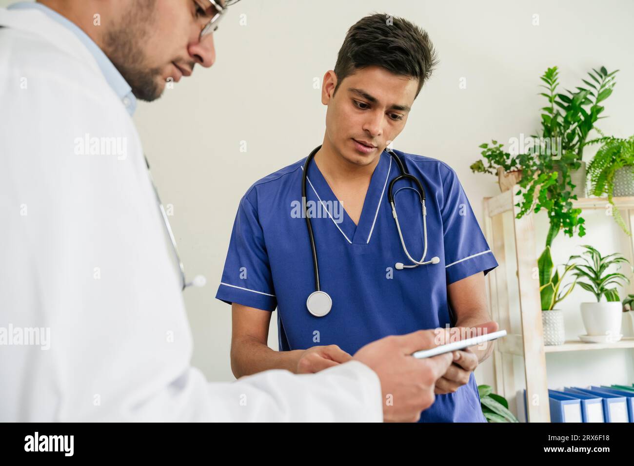 Two doctors using tablet PC together in clinic Stock Photo