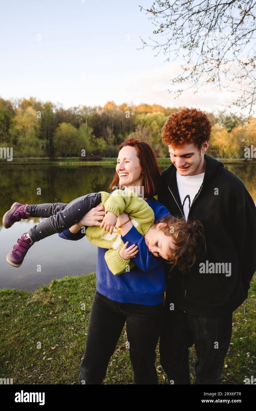 Happy mother with son and daughter enjoying in park Stock Photo