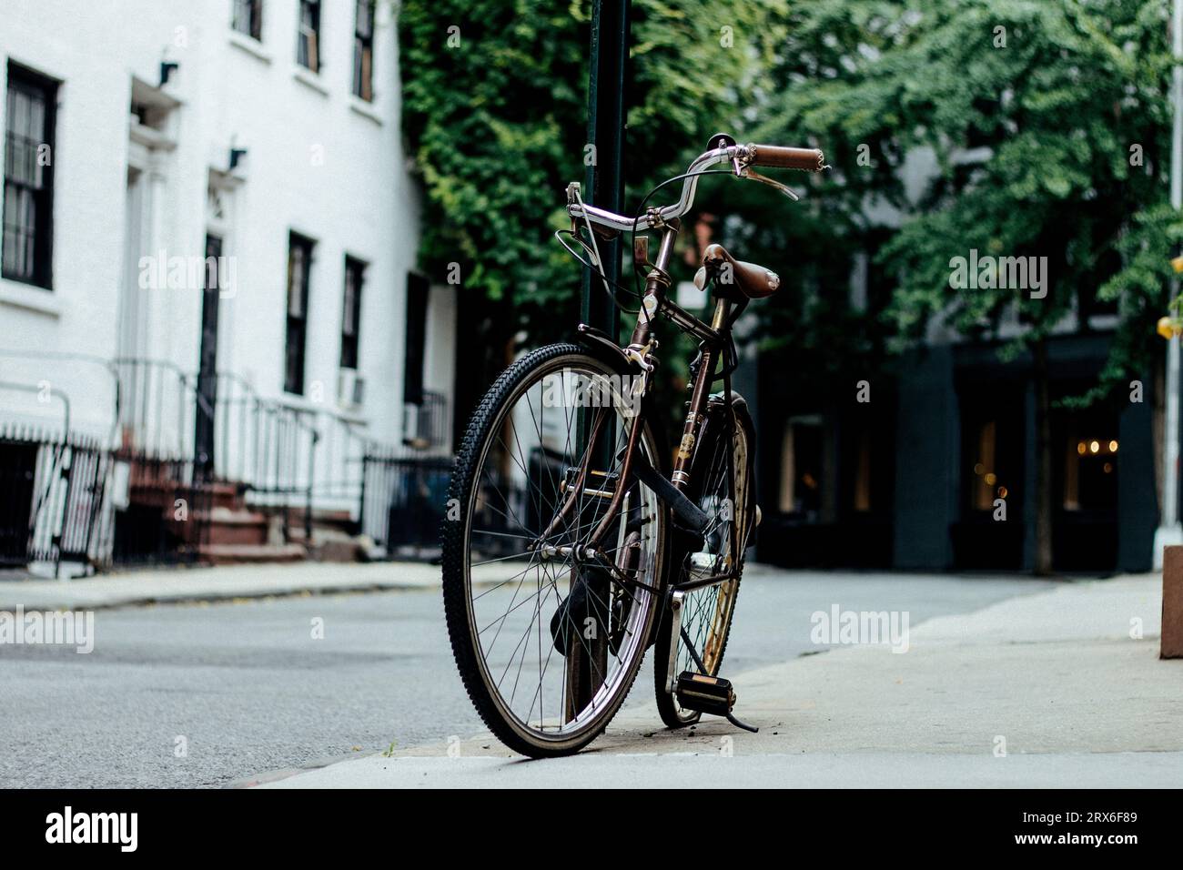 USA, New York State, New York City, Old-fashioned bicycle standing on street Stock Photo